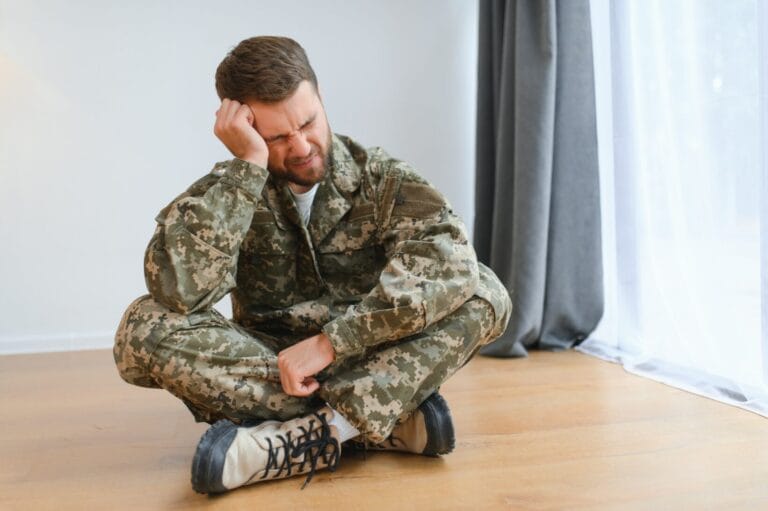 Crying professional soldier with depression and trauma after war